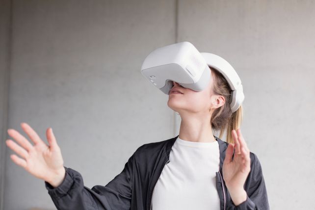 Girl trying out VR glasses