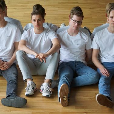 Image of four men wearing t-shirts from hamburchs koepfe brand