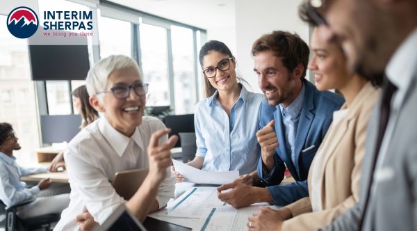 Employees talking during a stand up business meeting