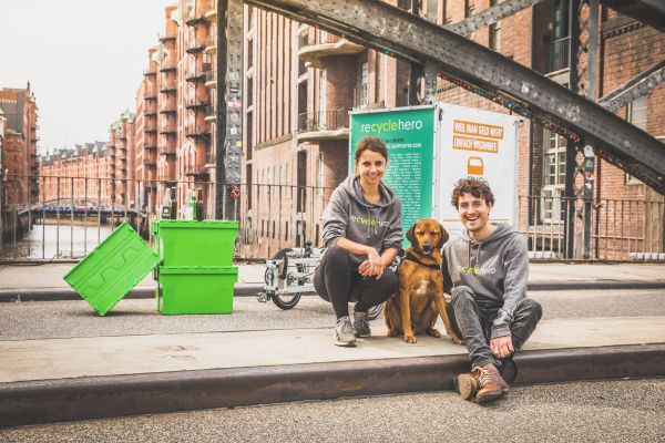 Two recyclehero driver and their dog